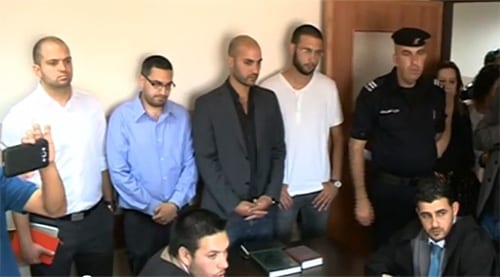 The four men in court. (Photo: Screenshot YouTube)